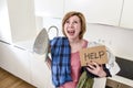 Angry woman or crazy busy housewife ironing shirt lazy at home k Royalty Free Stock Photo