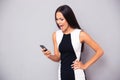 Angry woman in dress shouting on smartphone Royalty Free Stock Photo
