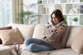 Angry woman getting cold at home in winter Royalty Free Stock Photo