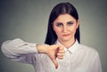 Angry woman giving thumbs down gesture Royalty Free Stock Photo
