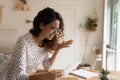 Angry woman in glasses reading letter, received unexpected bad news Royalty Free Stock Photo