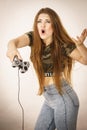 Angry woman holding gaming pad Royalty Free Stock Photo