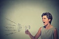 Angry woman holding screaming in megaphone Royalty Free Stock Photo