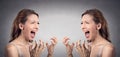 Angry woman hysterical screaming off at herself Royalty Free Stock Photo