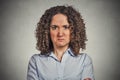 Angry woman isolated on grey wall background