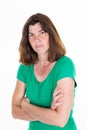 Angry woman middle aged standing with arms folded on white background