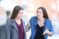 Angry woman scolding her guilty friend Royalty Free Stock Photo