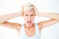 Angry woman screaming and holding her head Royalty Free Stock Photo