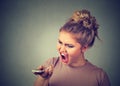 Angry woman screaming on mobile phone. Royalty Free Stock Photo