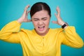 Angry woman screaming out and pulling her hair over background Royalty Free Stock Photo