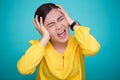 Angry woman screaming out and pulling her hair over background Royalty Free Stock Photo