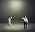 Angry woman screaming at tired man Royalty Free Stock Photo