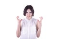 Angry woman with a short haircut and in an elegant white blouse, isolated on a white background. A frustrated and angry woman. Royalty Free Stock Photo