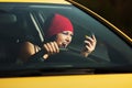 Angry woman shouting on the phone in a car Royalty Free Stock Photo