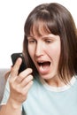 Angry woman talking mobile phone Royalty Free Stock Photo