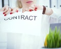 Angry woman tears agreement documents in front of camera closeup. Royalty Free Stock Photo