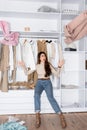 Angry woman throwing clothes while sitting Royalty Free Stock Photo