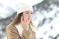 Angry woman using a sking protection cream in winter