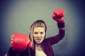 Angry woman wearing boxing gloves