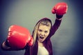 Angry woman wearing boxing gloves