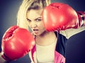 Angry woman wearing boxing gloves