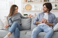 Angry woman yelling at her boyfriend chatting with girl Royalty Free Stock Photo