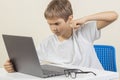 Angry young boy want to hit laptop computer