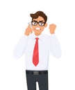 Angry young business man in formal speaking/talking on the mobile, cell or smart phone. Male character gesturing raised hand fist