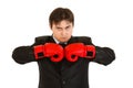 Angry young businessman with boxing gloves Royalty Free Stock Photo