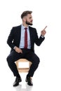 Angry young businessman pointing finger to side and blaming Royalty Free Stock Photo