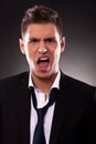 Angry young businessman shouting Royalty Free Stock Photo