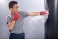 Angry young child boxing in bag Royalty Free Stock Photo