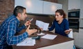 Angry young couple arguing by credit card debts Royalty Free Stock Photo