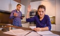 Angry young couple arguing by their debts Royalty Free Stock Photo