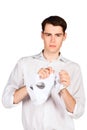 Angry young man crumples tears paper Royalty Free Stock Photo