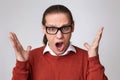 angry young man in glasses and shirt screaming or shouting Royalty Free Stock Photo