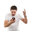 Angry young man with mobile phone Royalty Free Stock Photo