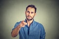 Angry young man pointing finger at you camera gesture Royalty Free Stock Photo