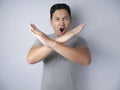 Angry Young Man Shows Stop Sign Crossed Arms gesture Royalty Free Stock Photo