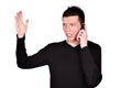 Angry young man talking on phone Royalty Free Stock Photo