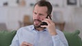 Angry Young Man Talking on Phone Royalty Free Stock Photo