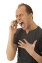 Angry young man with a phone Royalty Free Stock Photo