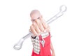 Angry young mechanic holding a wrench to the camera Royalty Free Stock Photo