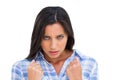 Angry young woman with closed fists looking at camera Royalty Free Stock Photo