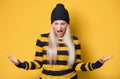 Angry young woman with hands on head and tearing hair out while looking to camera, isolated on white background Royalty Free Stock Photo