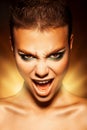 Angry young woman looking at camera and scream Royalty Free Stock Photo