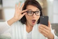 angry young woman looking at smartphone frustrated Royalty Free Stock Photo