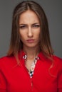 Angry young woman in red polo shirt Royalty Free Stock Photo