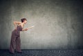 Angry young woman with rolling pin screaming Royalty Free Stock Photo