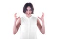 Angry young woman with a short haircut and in an elegant white blouse, isolated on a white background. An angry woman. Royalty Free Stock Photo